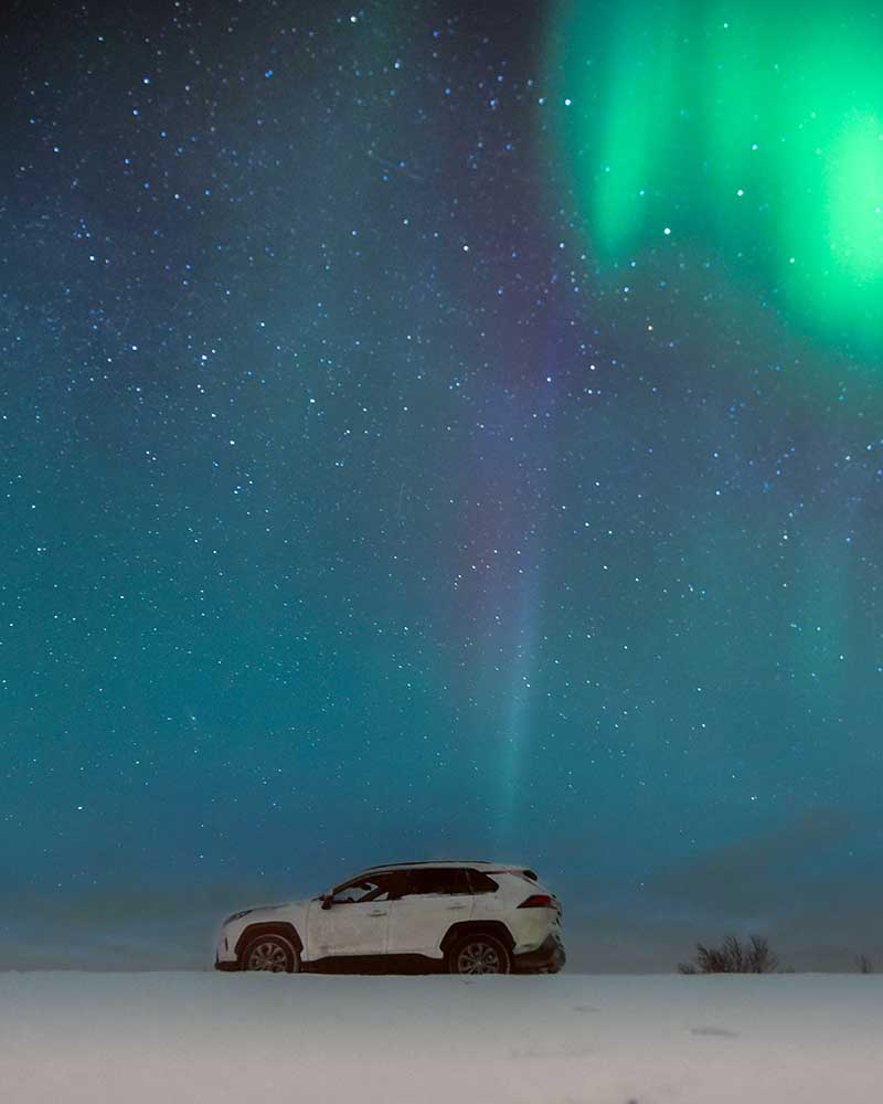 SUV from Holdur Car Rental Europcar Iceland under the midnight stars