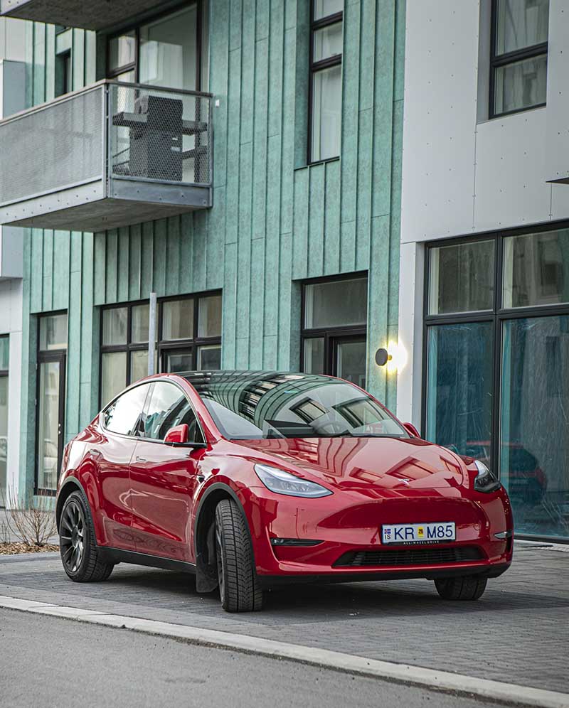Red Tesla Y, Iceland Electric Car Rental