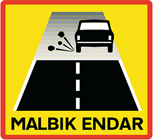 End of paved road warning sign