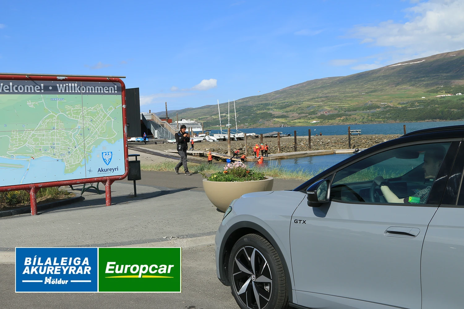 Volkswagen ID.5 from Europcar Holdur car rental in Iceland entering the town of Akureyri in th north