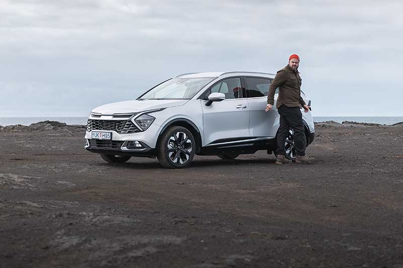 Man parking rental car at Krysuvikurbjarg Cliffs