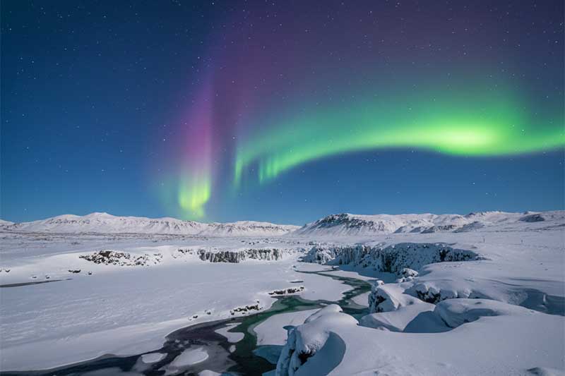 Aurora Borealis dancing in the sky above Þingvellir National Park, Hakid Viewpoint