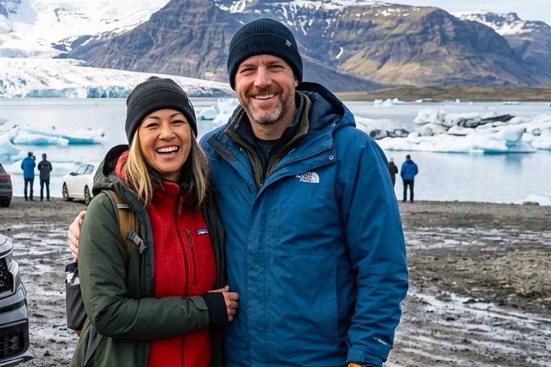 Smiling couple on April road trip in Iceland
