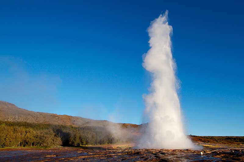 Strokkur geyser erupting in Iceland’s geothermal field